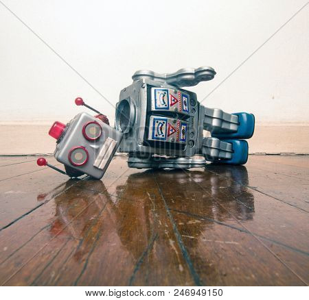 vintage bot lost his head on a old wooden floor with reflection 