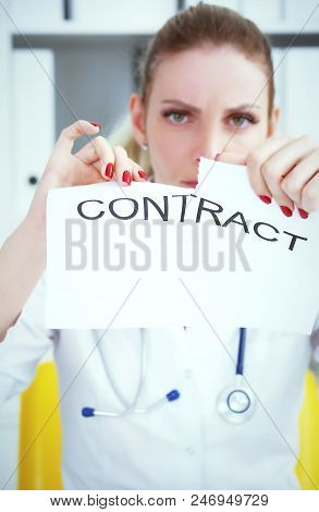 Hands Of Female Medicine Doctor Ripping Contract Closeup. Break The Rules - Failure Business Concept