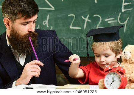 Father Checking Hometask, Helps To Boy, Son. Hometask Concept. Enthusiastic Kid Studying With Teache