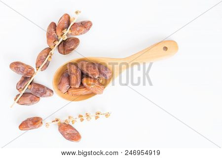 Dates Fruit In Wooden Ladle On White Background,dried Date Palm Fruits Top View