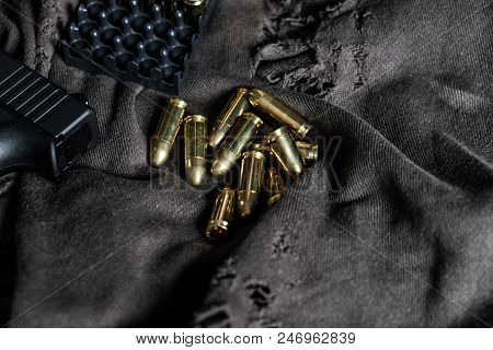 Full Metal Jacket 9Mm Ruger Bullet On Cloth Texture