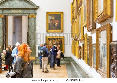 London, Uk - August 15, 2017 - A Female Visitor Admiring Paintings Displayed At Tate Britain