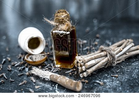 Popular Home Remedy For Toothache Or Tooth Related Problems I.e Clove Oil With Powder Of Black Peppe