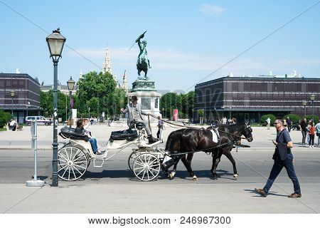 Vienna, Austria - July 13, 2018: Close Up Of Tourists In A Horse-drawn Carriage Called Fiaker At The