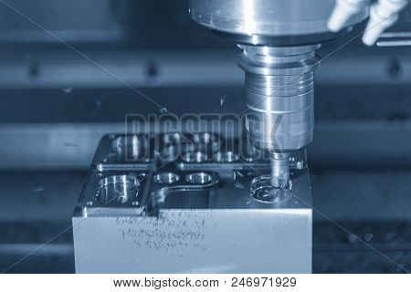 The Cnc Milling Machine Cutting The Mold Part In Roughing   Process With The Index-able Radius End-m