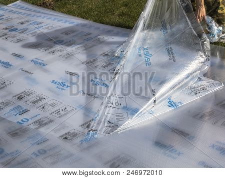 Moscow/ Russia-22 May 2018;removing The Protective Film From Polycarbonate