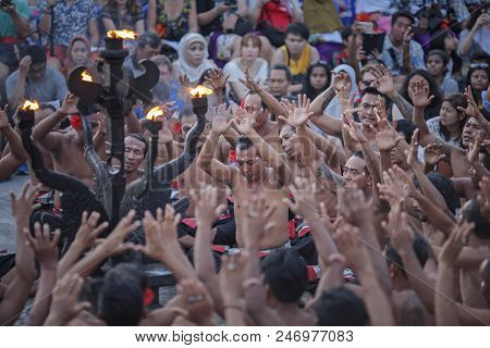 Bali, Indonesia - April 19: Tourists Watch Traditional Balinese Kecak Dance At Uluwatu Temple On Bal