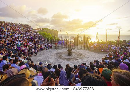 Bali, Indonesia - April 19: Tourists Watch Traditional Balinese Kecak Dance At Uluwatu Temple On Bal