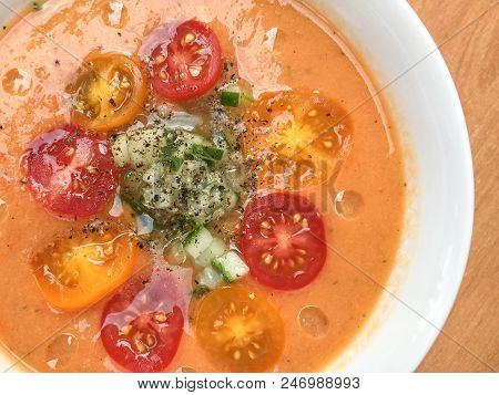 Gazpacho Soup With Slised Tomatoes, Cucumber, Pepper And Oil Drops