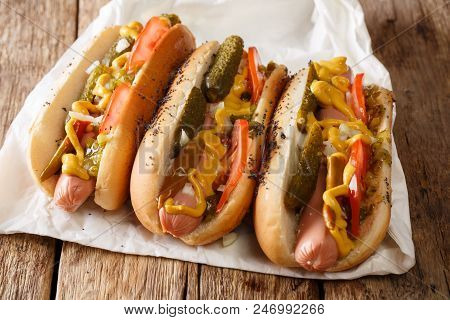Delicious Chicago Style Hot Dog With Mustard, Vegetables And Relish Close-up. Horizontal