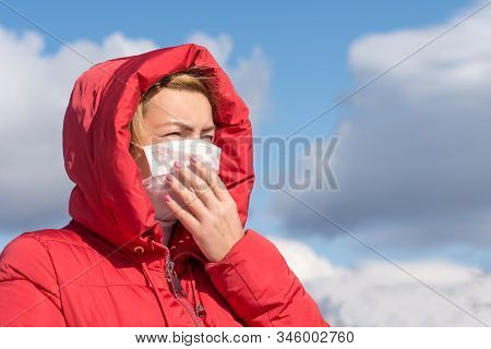 The Woman Wears A Protective Mask From Allergies, Viruses, Air Pollution. Concept Climate Change.