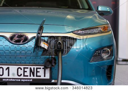 Charging An Plug-in Hybrid Hyundai Kona With The Power Cable Supply Plugged In, Prague, Czechia, Nov