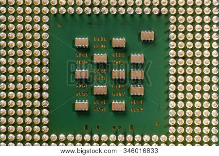 Old Computer Processor With Gold-plated Legs, Microcircuits On It, Top View Close-up