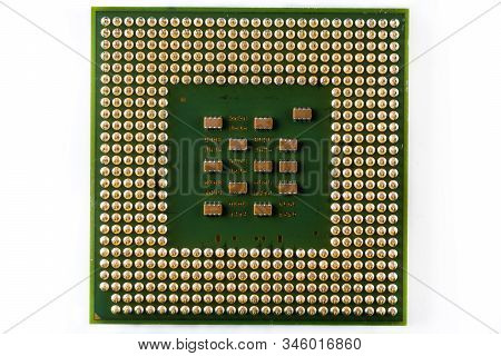Old Computer Processor With Gold-plated Legs, Microcircuits On It, Isolated On White Background Top 