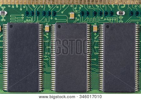 Green Microchip Of Old Computer Random Access Memory With Black Microcircuits, Top View, Macro Photo