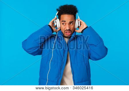 Cringing And Bothered African-american Man Grimacing Hearing Bad Sound Quality Of Headphones, Dont L
