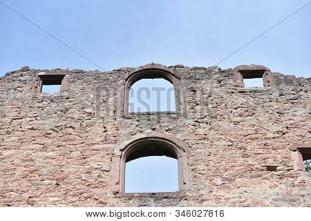 Stone Wall Ruins Of An Old Castle Of Schloss Neuenburg In Germany, Against A Blue Sky With Text Spac