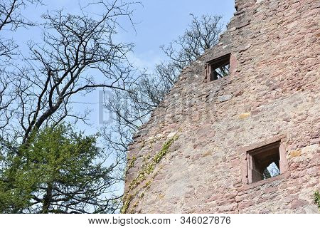 Stone Wall Ruins Of An Old Castle Of Schloss Neuenburg In Germany, Against A Blue Sky With Text Spac
