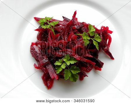 Beet Salad With Parsley On A White Plate