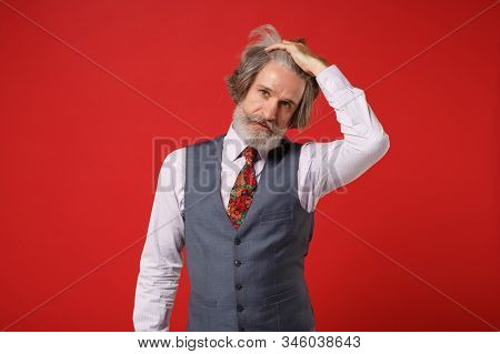 Handsome Elderly Gray-haired Mustache Bearded Man In Classic Shirt Vest Colorful Tie Posing Isolated