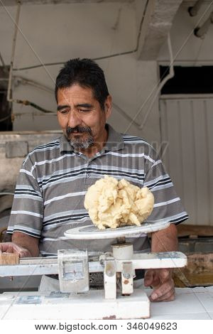 Man Selling Dough In Nixtamal Mill