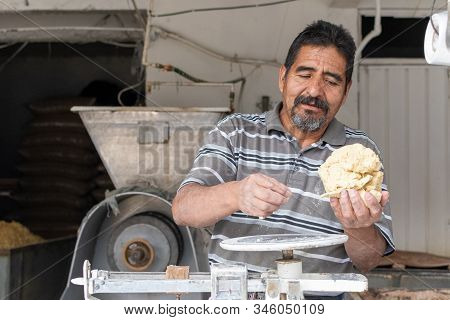 Man Selling Dough In Nixtamal Mill