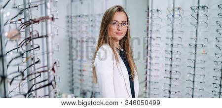Row Of Glasses At An Opticians. Eyeglasses Shop. Stand With Glasses In The Store Of Optics. Womans H