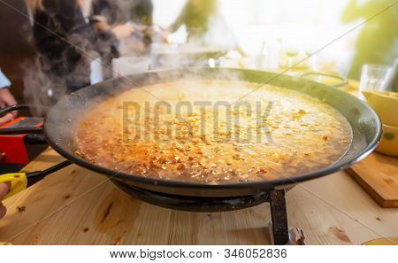Paella Pan With Traditional Spanish Food Usually Prepared With Rice, Meat, Seafood