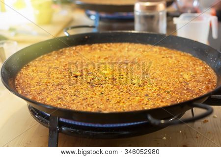 Paella Pan With Traditional Spanish Food Usually Prepared With Rice, Meat, Seafood. Horizontal Orien