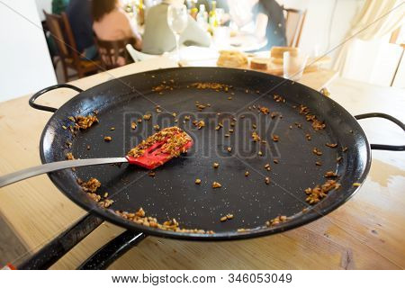 Empty Paella Pan With Traditional Spanish Food Usually Prepared With Rice, Meat, Seafood