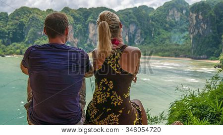 Couple On View Point To Hat Tom Sai Beach At Railay, Krabi, Thailand.