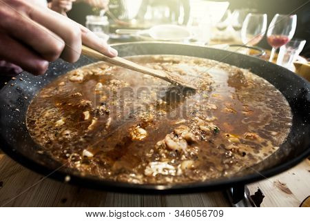 Paella Pan With Traditional Spanish Food Usually Prepared With Rice, Meat, Seafood