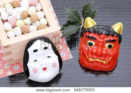 Japanese Traditional Setsubun Event, Soybeans And Masks Of Oni Demon And Otafuku Are Used On An Annu