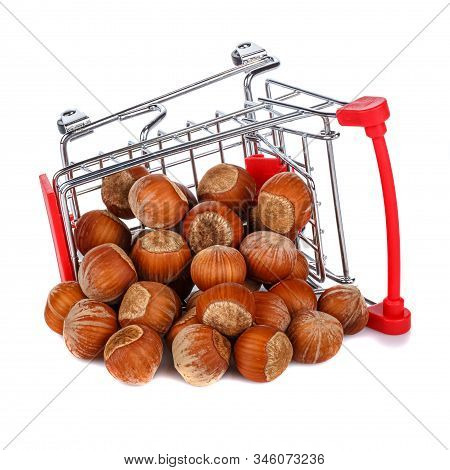 Crumbled Hazelnuts In The Lying On Its Side Chromed Toy Market Shopping Cart With Red Handle And Pla