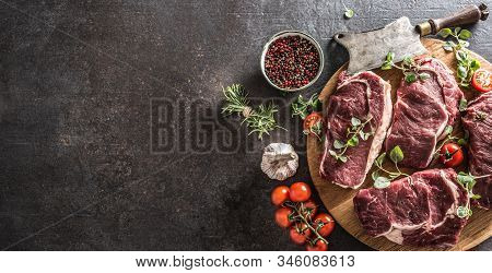 Beef Ribe Eye Steaks With Rosemary Oregano And Tomatoes Top Of View.