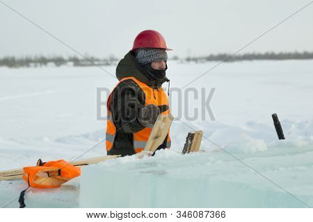 Slinger In An Orange Helmet At The Installation Site