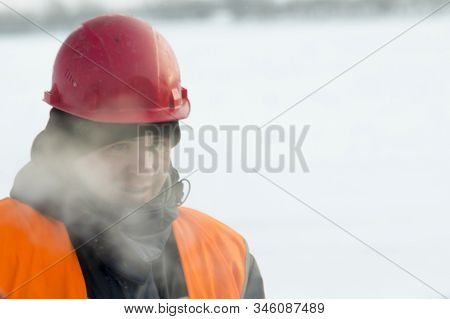 Slinger In An Orange Helmet At The Installation Site