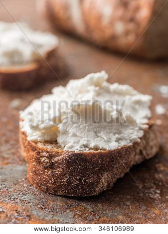 Whole Grain Bread Bruschetta With White Soft Curd Cream Cheese On A Ginger Grunge Background. Close-