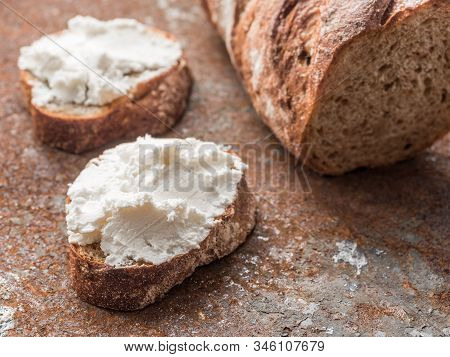 Whole Grain Bread Bruschetta With White Soft Curd Cream Cheese On A Ginger Grunge Background. Close-