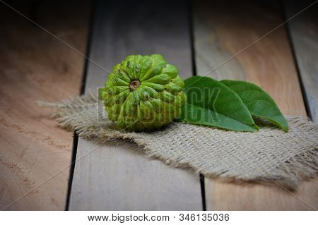 Fresh Custard Apple On Wooden Table Background