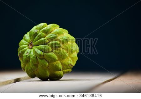 Fresh Custard Apple On Wooden Table Background