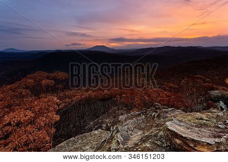 Sunset Over Charrred Landscape After Bush Fires Swept Through Parts Of Blue Mountains Australia In S