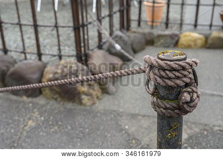 Rope Tied To A Natural Background Symbolizes The Concept