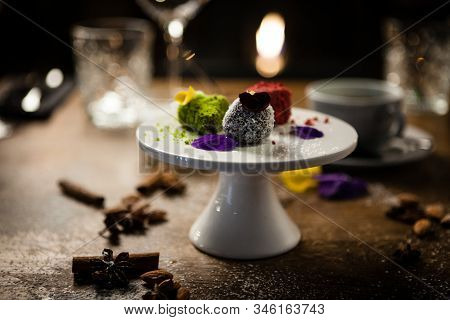 Vegan Truffles Dessert Served On A Plate In Restaurant
