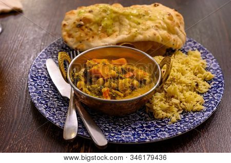 Mangalorean Style Roasted Cauliflower And Spinach Curry With Basmati Rice And Garlic Naan Bread, Tas