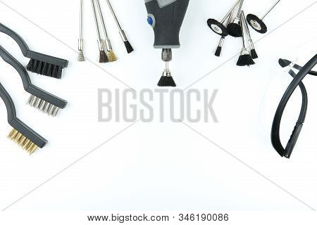 Electric Rotary Tool And Cleaning Tools Set On White Background With Copy Space Flat Lay