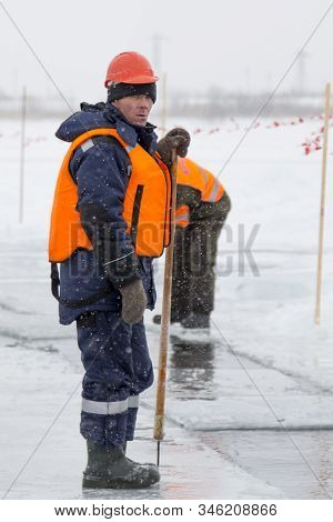 Installers In Life Jackets Rafting Ice Panels To The Lane With The Beograms