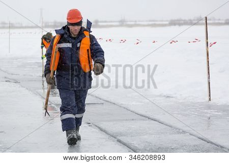 Installers In Life Jackets Rafting Ice Panels To The Lane With The Beograms
