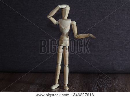 A Figurine Of A Wooden Man Remembers What Happened