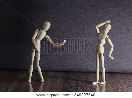 A Figurine Of A Wooden Man Admits Love And Flirts. The Relationship Between The Sexes.